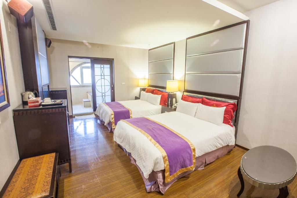 Postel nebo postele na pokoji v ubytování Spring Breeze Hotel