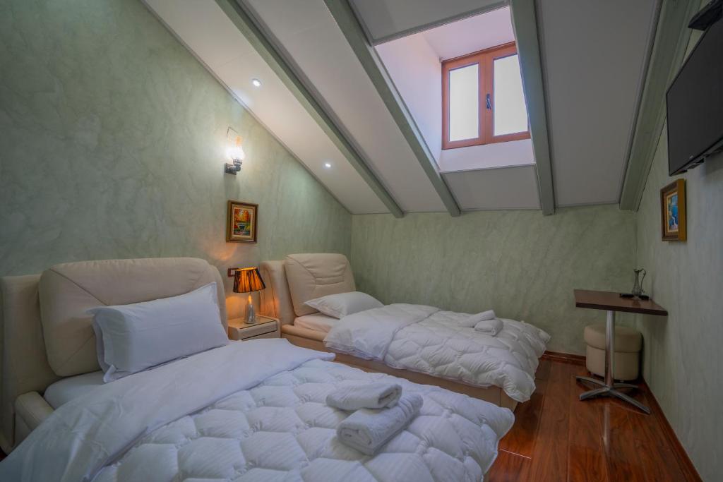 Postel nebo postele na pokoji v ubytování Hotel Durham