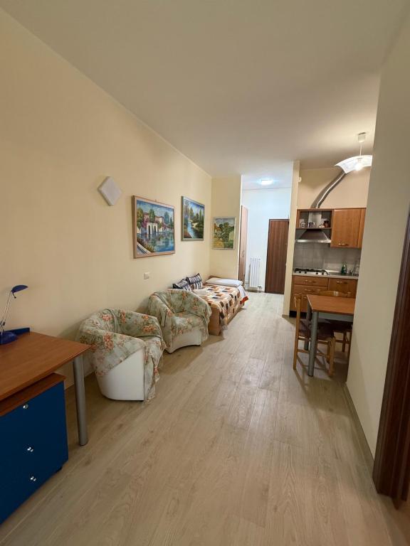 a living room with a couch and a table at Casa Vacanze Nico in Lizzanello