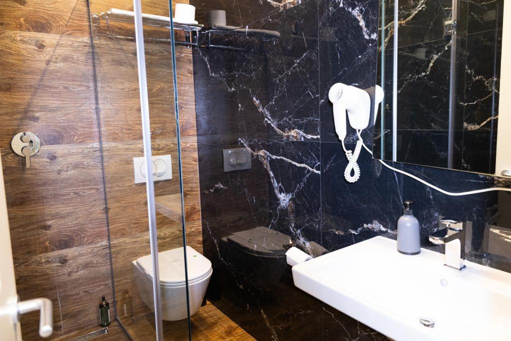Koupelna v ubytování 4R Colombo Hotel