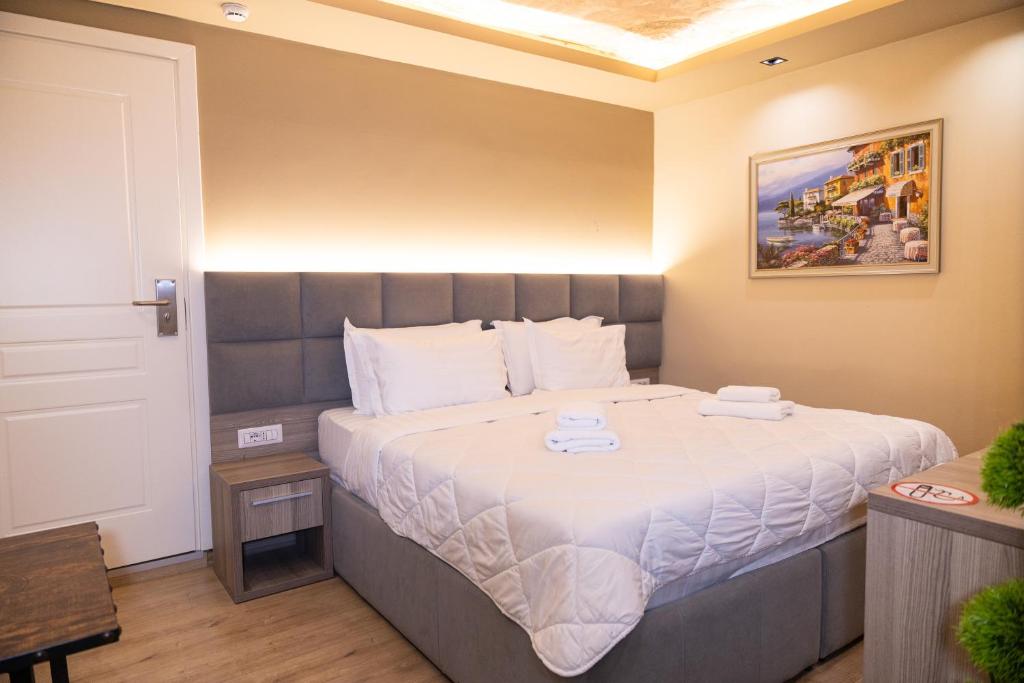 Postel nebo postele na pokoji v ubytování 4R Colombo Hotel