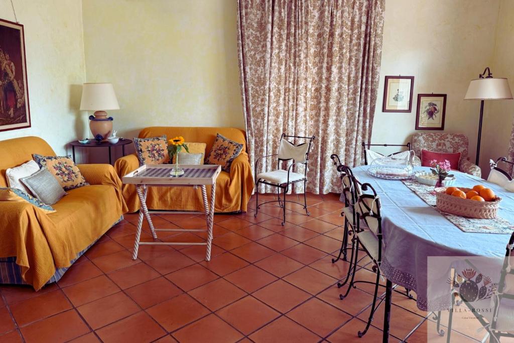 a living room with a couch and a table at Villa Rossi in Polignano a Mare