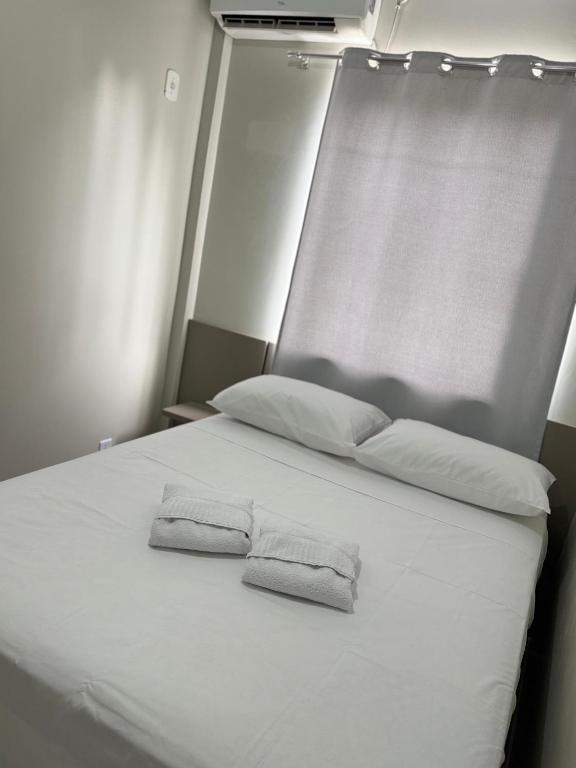 Postel nebo postele na pokoji v ubytování Hotel Andorinha