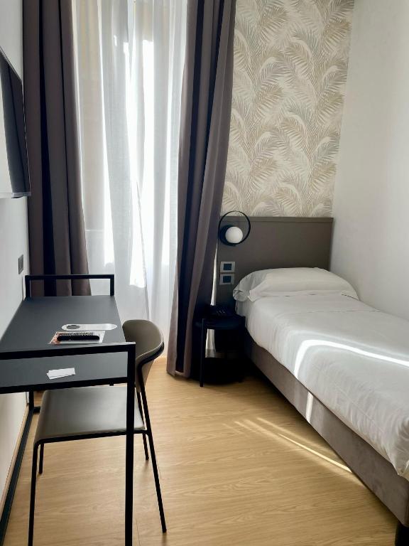 Postel nebo postele na pokoji v ubytování Hotel Patria