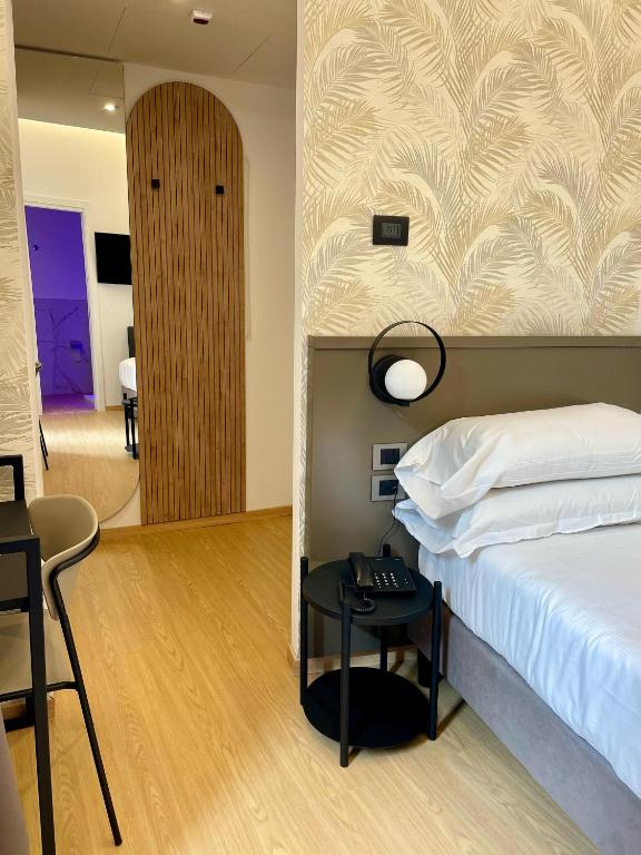 Postel nebo postele na pokoji v ubytování Hotel Patria