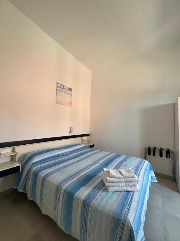 Postel nebo postele na pokoji v ubytování Hotel Flora
