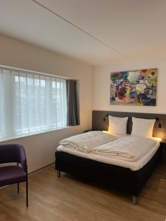 Postel nebo postele na pokoji v ubytování Cabinn Plus Esbjerg