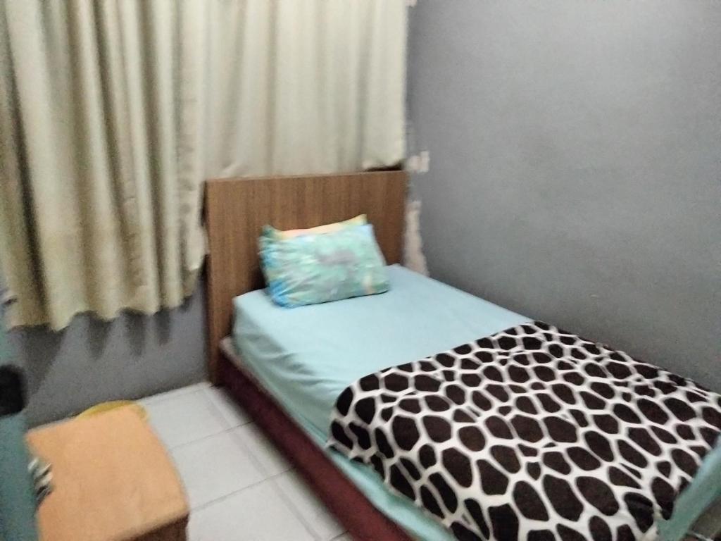 Postel nebo postele na pokoji v ubytování Hotel Bajet DNOOR Kota Bharu