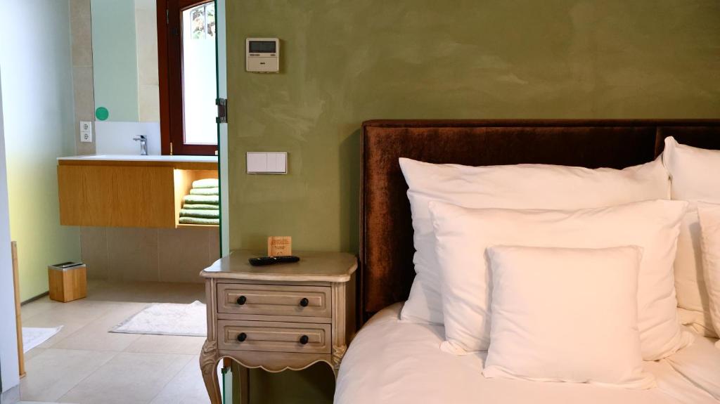 Postel nebo postele na pokoji v ubytování CASA TESS boutique hotel