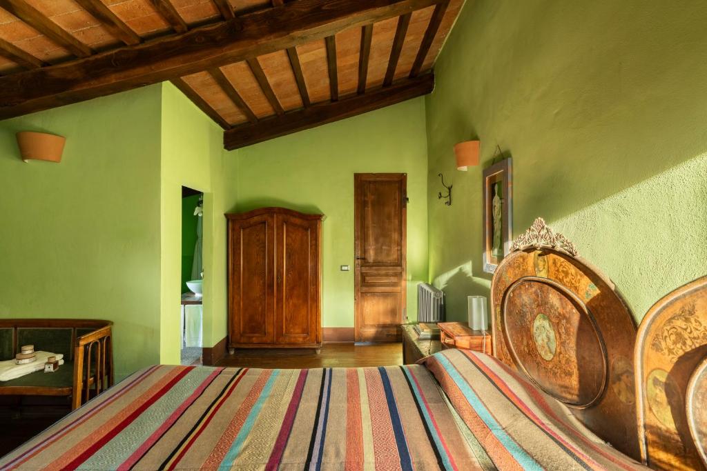 Postel nebo postele na pokoji v ubytování B&B - Podere Monti