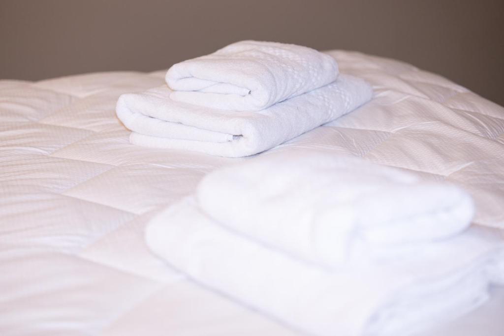 Postel nebo postele na pokoji v ubytování 4R Colombo Hotel