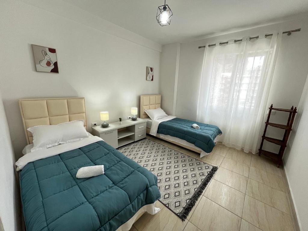 Postel nebo postele na pokoji v ubytování Moon City Center Apartment