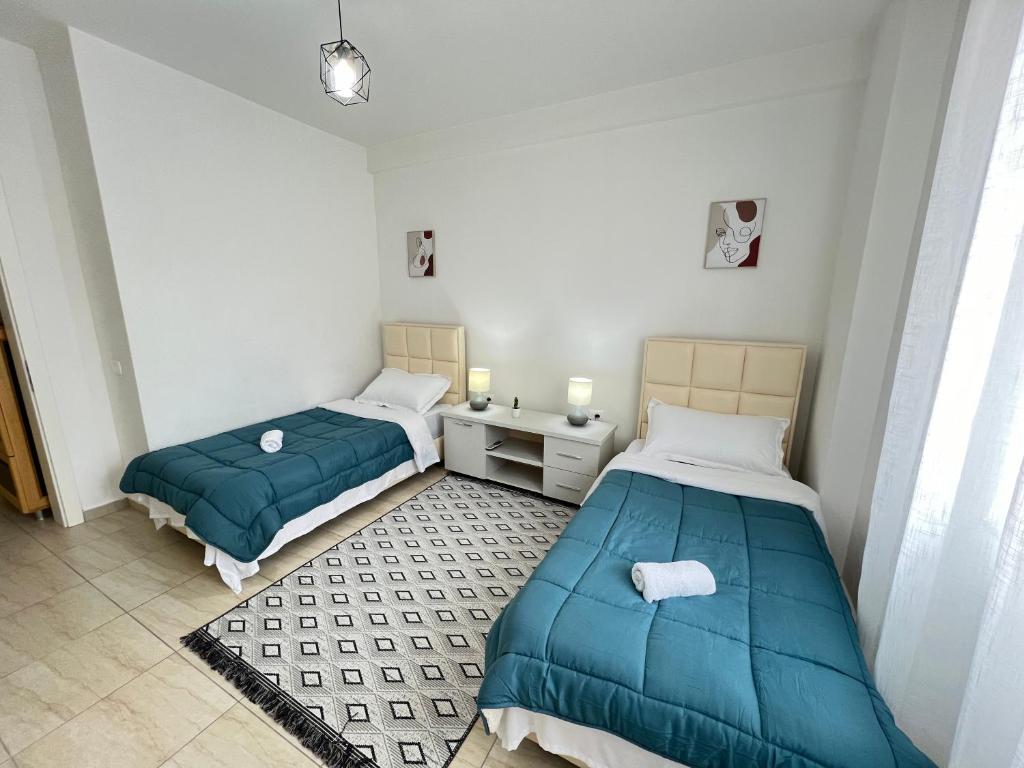 Postel nebo postele na pokoji v ubytování Moon City Center Apartment
