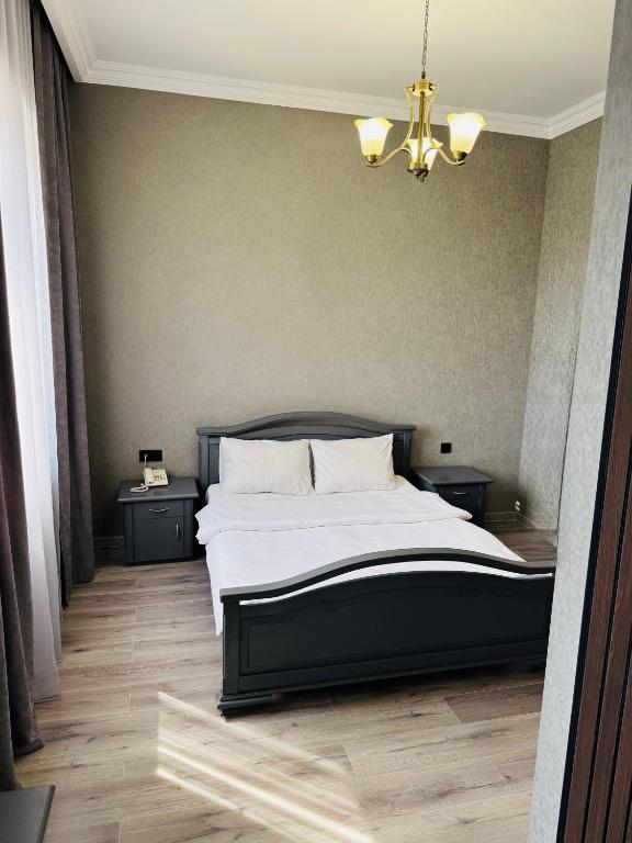 Postel nebo postele na pokoji v ubytování Capital Hotel