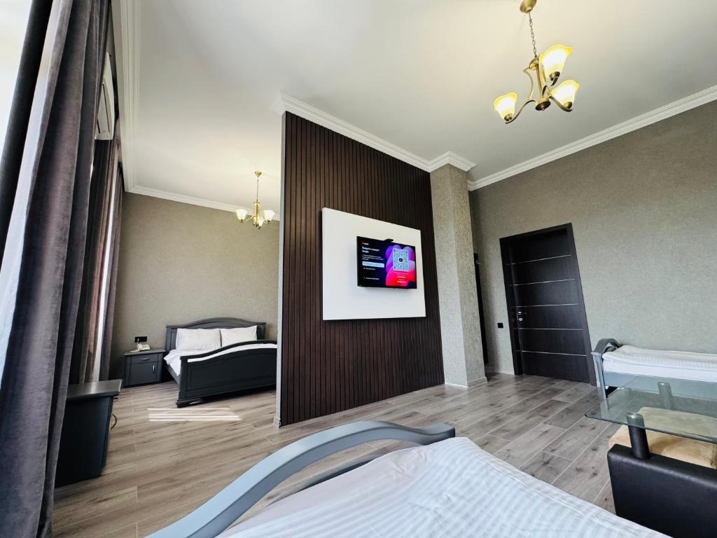 Postel nebo postele na pokoji v ubytování Capital Hotel