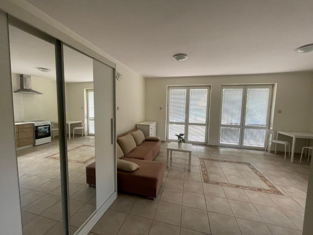 a living room with a couch and a table at Apartamenty Bolszewo in Bolszewo