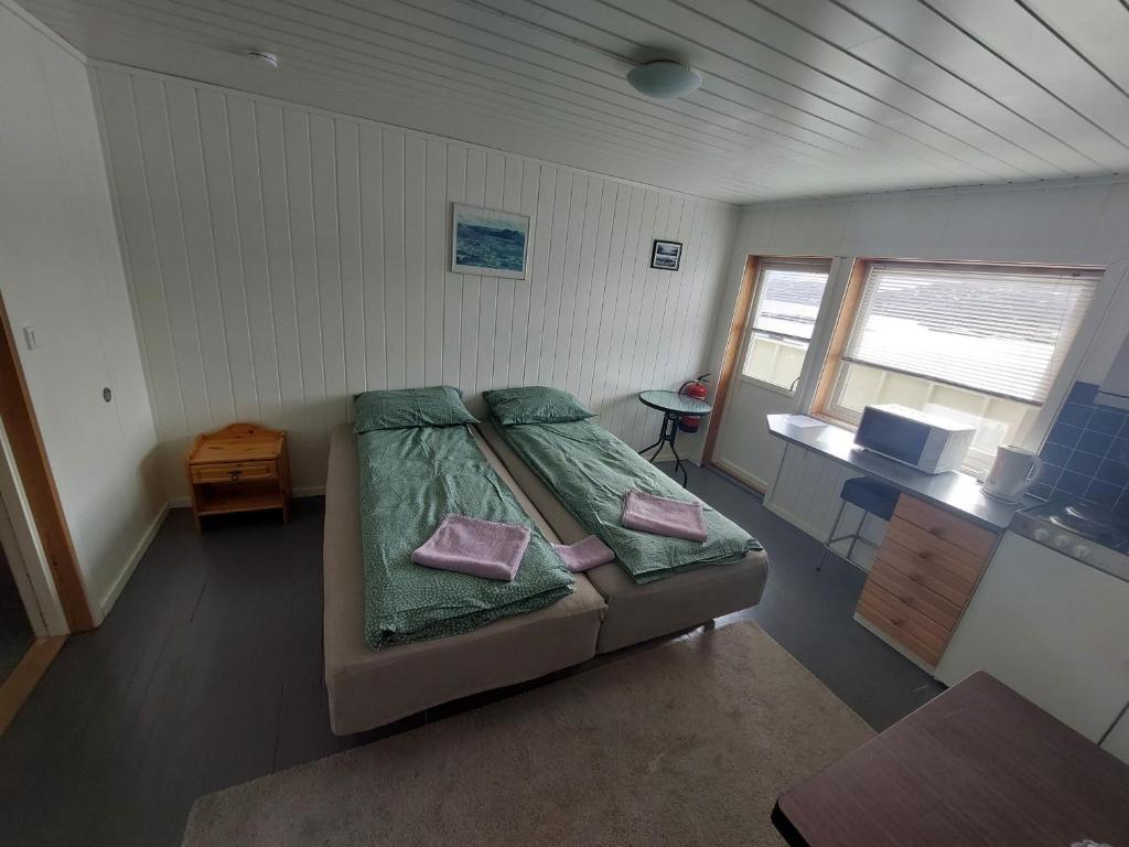 Postel nebo postele na pokoji v ubytování Vaterfjord Brygge