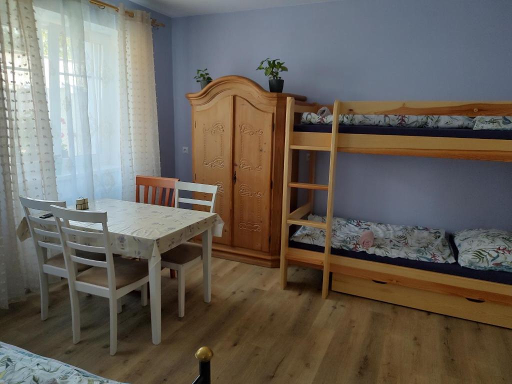 Postel nebo postele na pokoji v ubytování Hortenzie