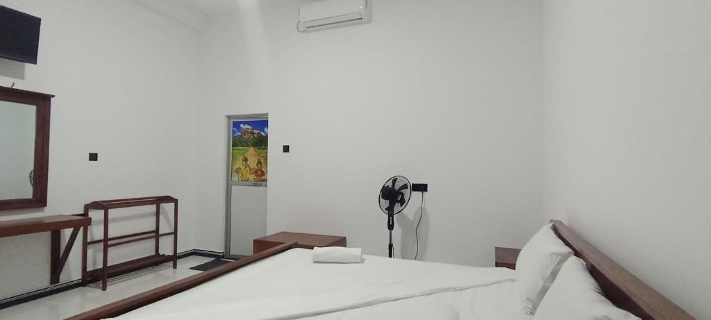 Postel nebo postele na pokoji v ubytování Lion See Hotel - Sigiriya