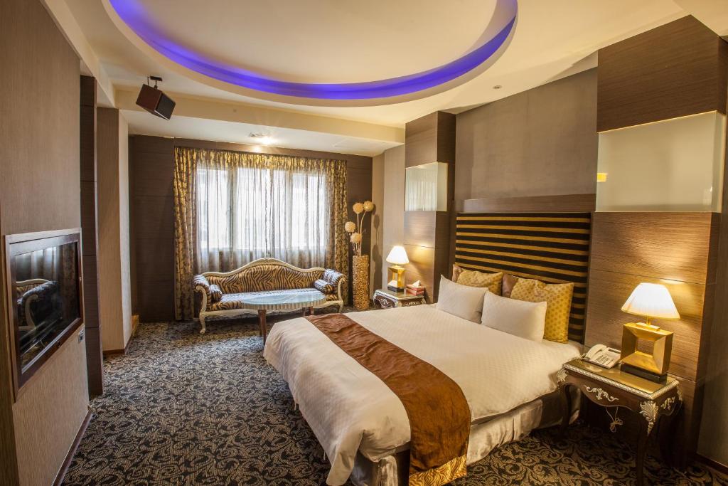 Postel nebo postele na pokoji v ubytování Spring Breeze Hotel