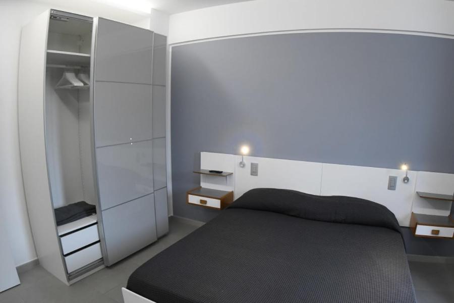 Postel nebo postele na pokoji v ubytování Golden Beach Residence
