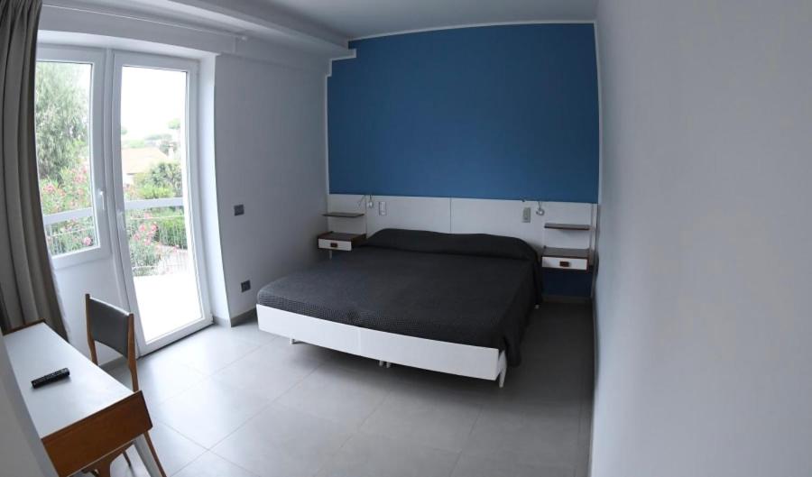 Postel nebo postele na pokoji v ubytování Golden Beach Residence