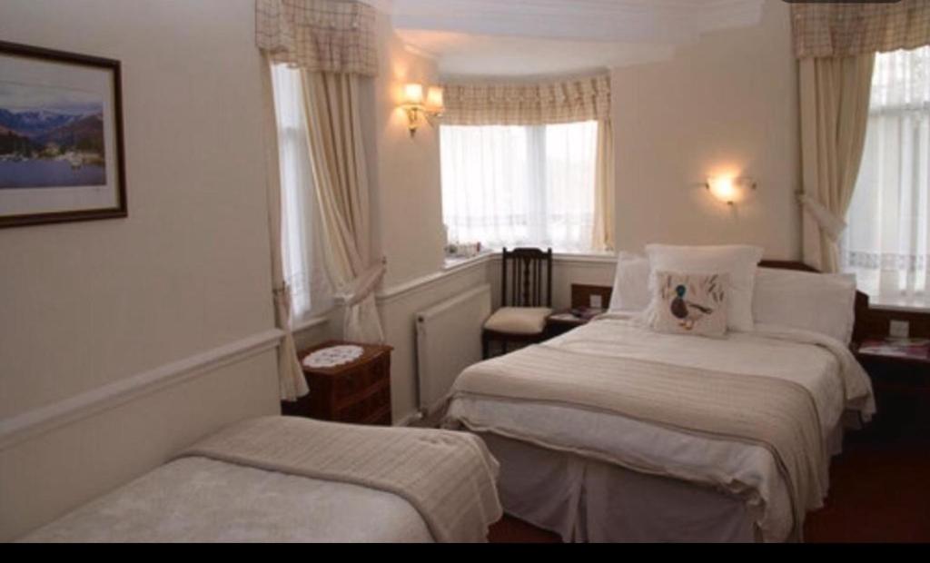 Postel nebo postele na pokoji v ubytování Windermere Lynwood Guest House