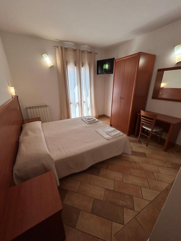 Postel nebo postele na pokoji v ubytování Hotel GANS