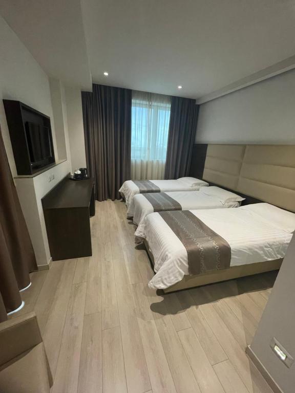 HotelLuxuryPrato客房内的一张或多张床位