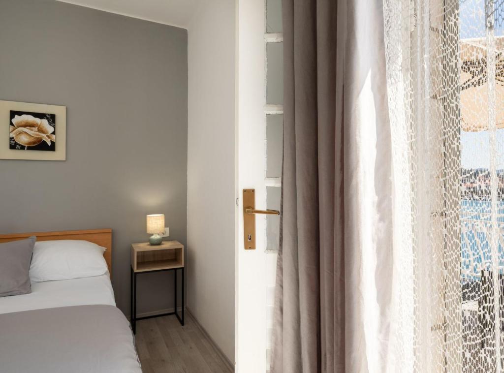 Posteľ alebo postele v izbe v ubytovaní Seaside Apartment Franica