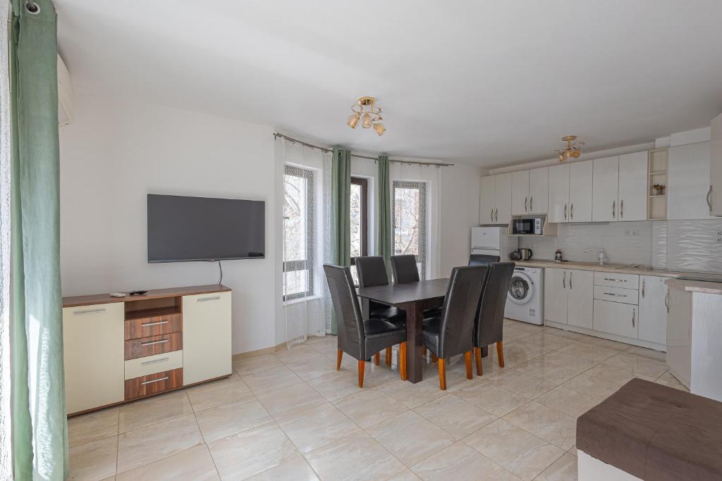 a kitchen and dining room with a table and chairs at Sea Garden Marina 3 in Varna City