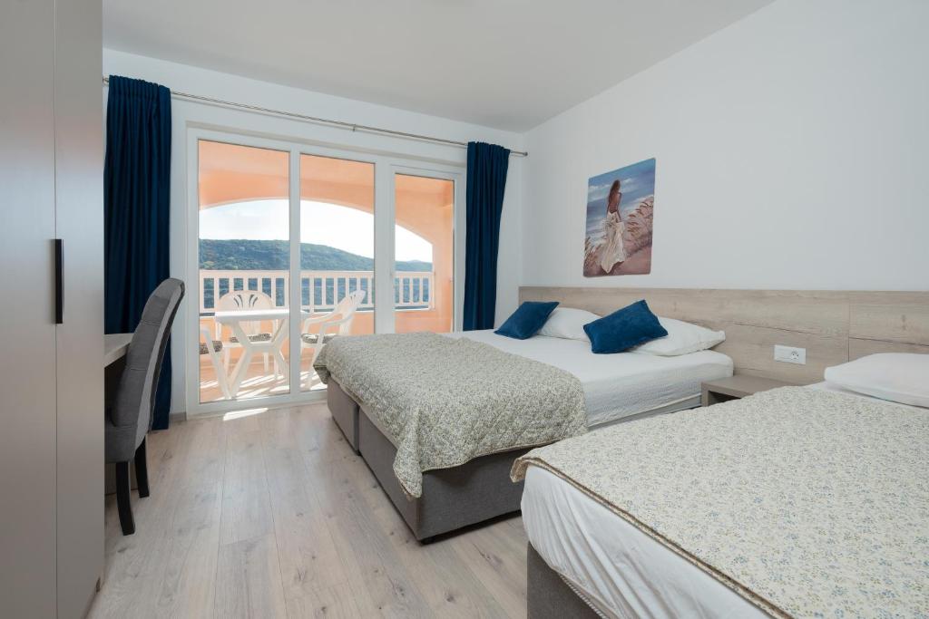 Postel nebo postele na pokoji v ubytování Apartments Obradović