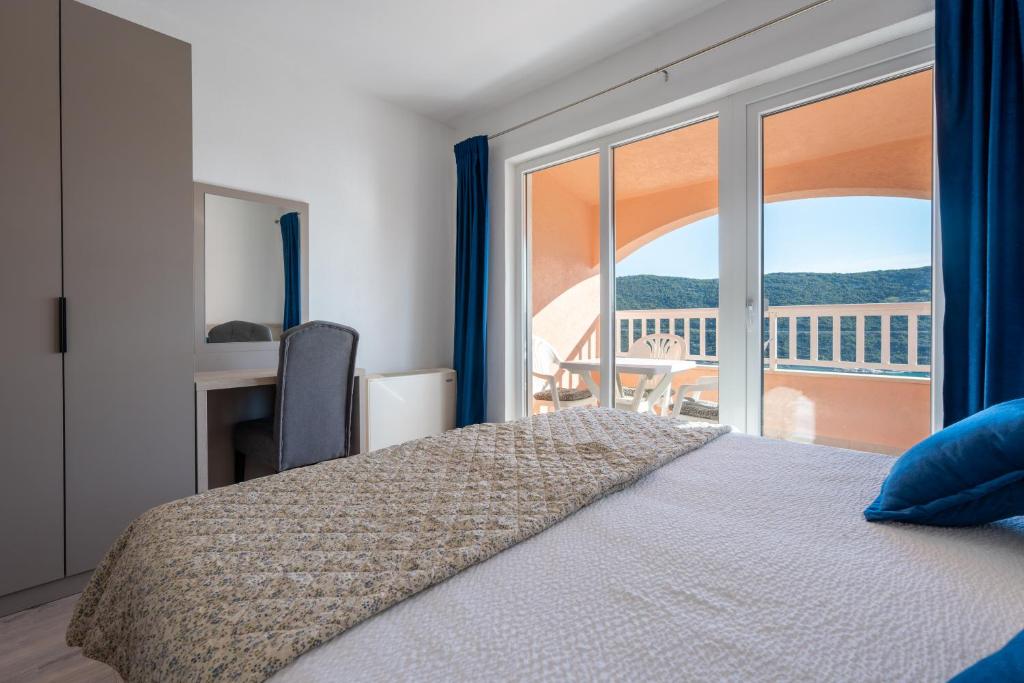 Postel nebo postele na pokoji v ubytování Apartments Obradović