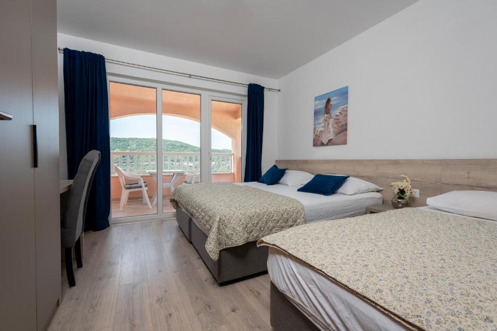 Postel nebo postele na pokoji v ubytování Apartments Obradović