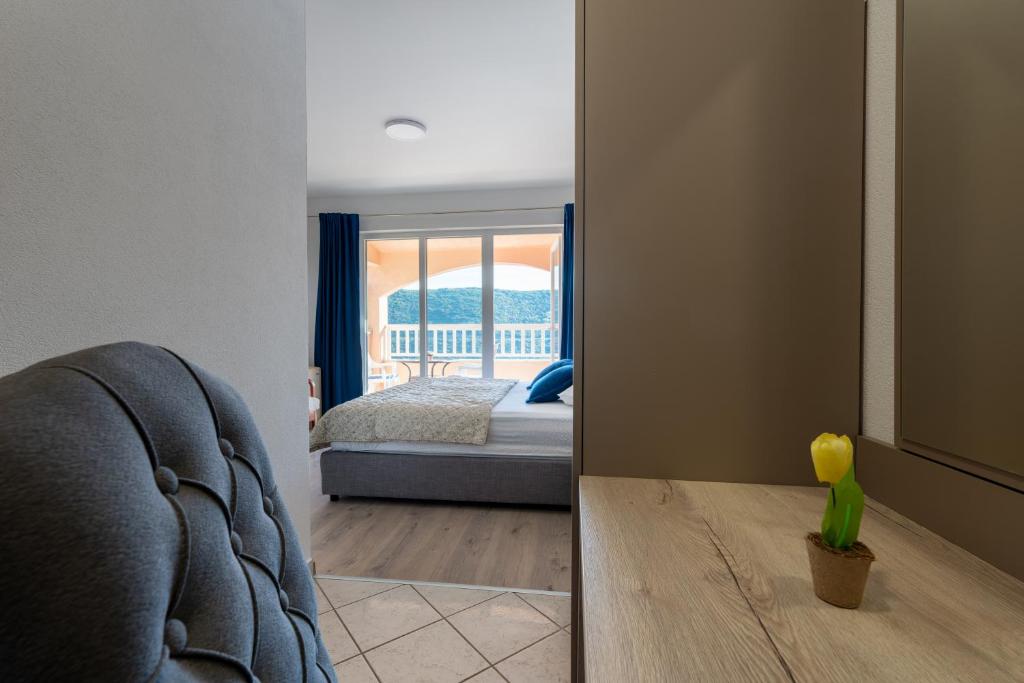 Postel nebo postele na pokoji v ubytování Apartments Obradović