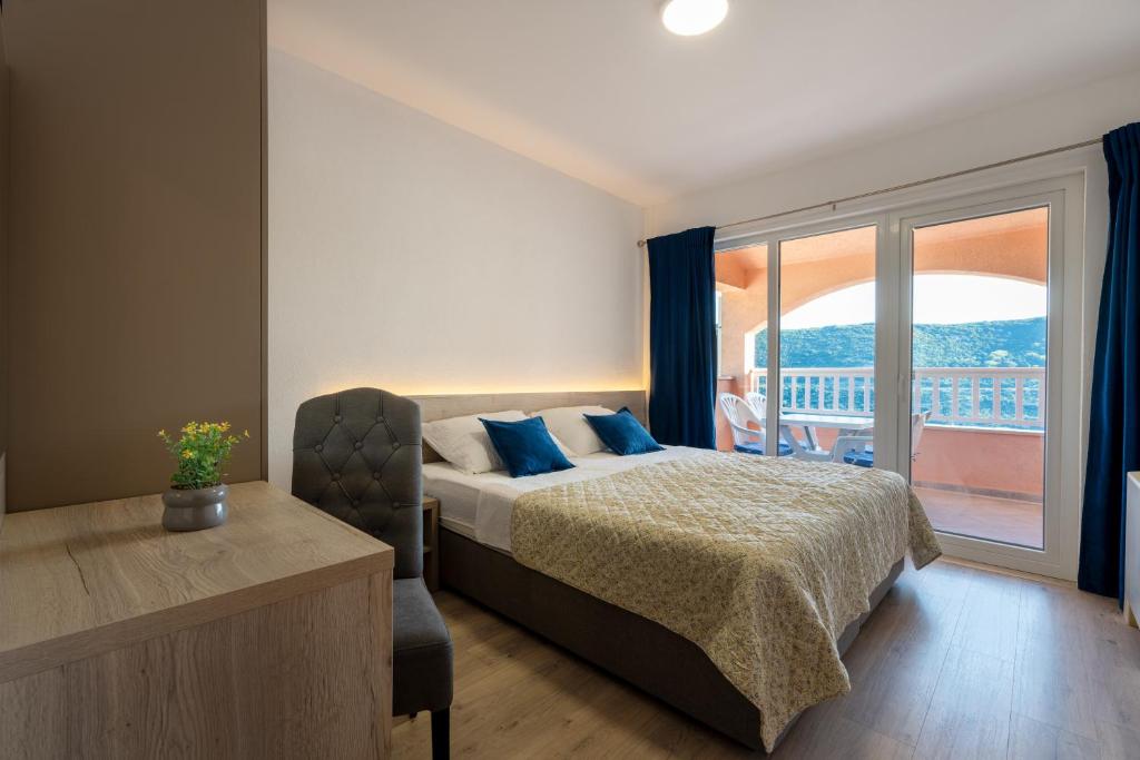 Postel nebo postele na pokoji v ubytování Apartments Obradović