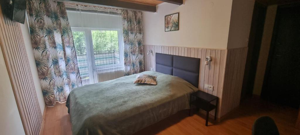 Postel nebo postele na pokoji v ubytování Alaska