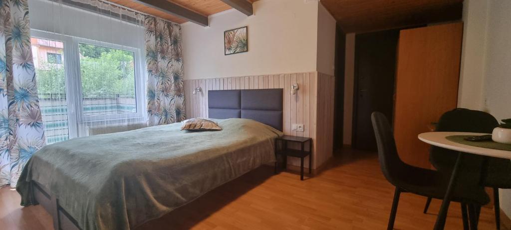 Postel nebo postele na pokoji v ubytování Alaska
