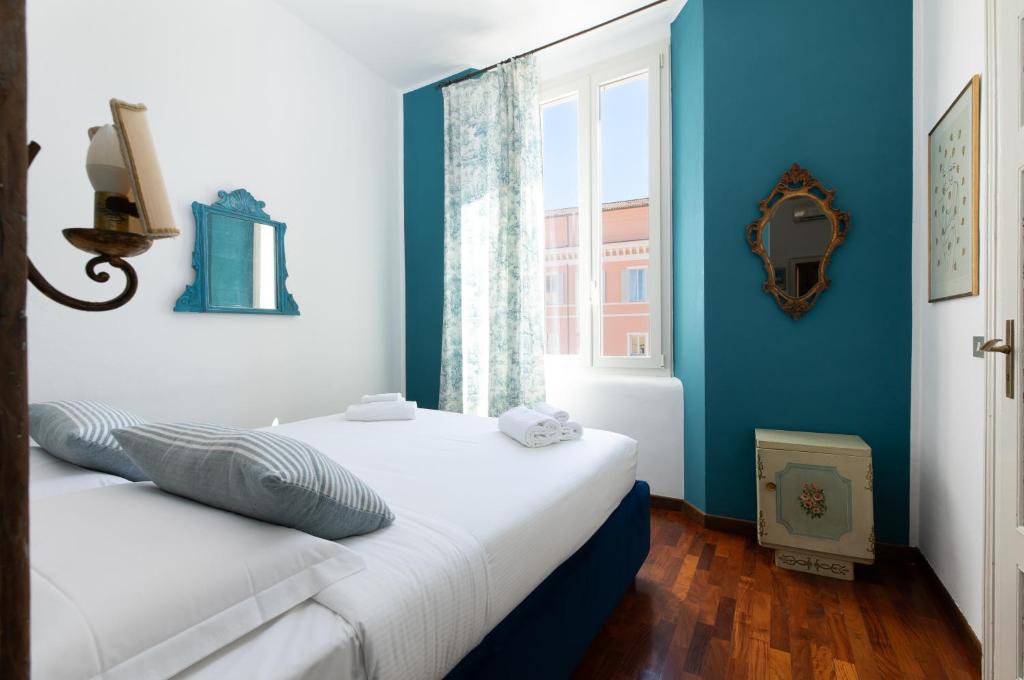 Posteľ alebo postele v izbe v ubytovaní In Piazza 'Apartments & Relax'