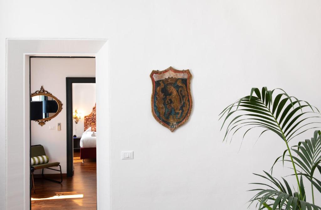 Posteľ alebo postele v izbe v ubytovaní In Piazza 'Apartments & Relax'