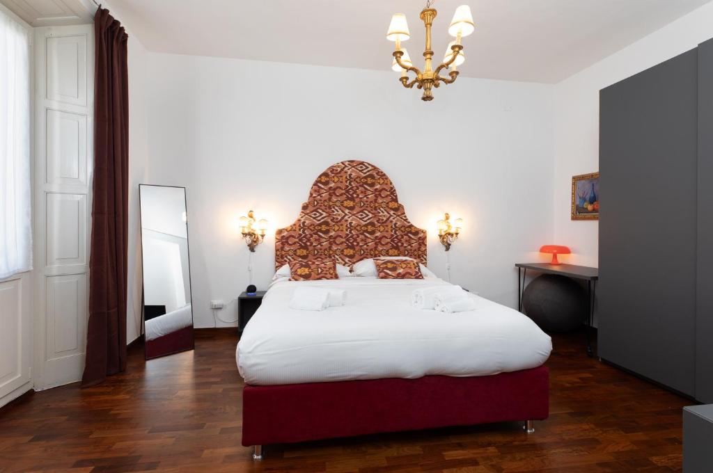 Posteľ alebo postele v izbe v ubytovaní In Piazza 'Apartments & Relax'