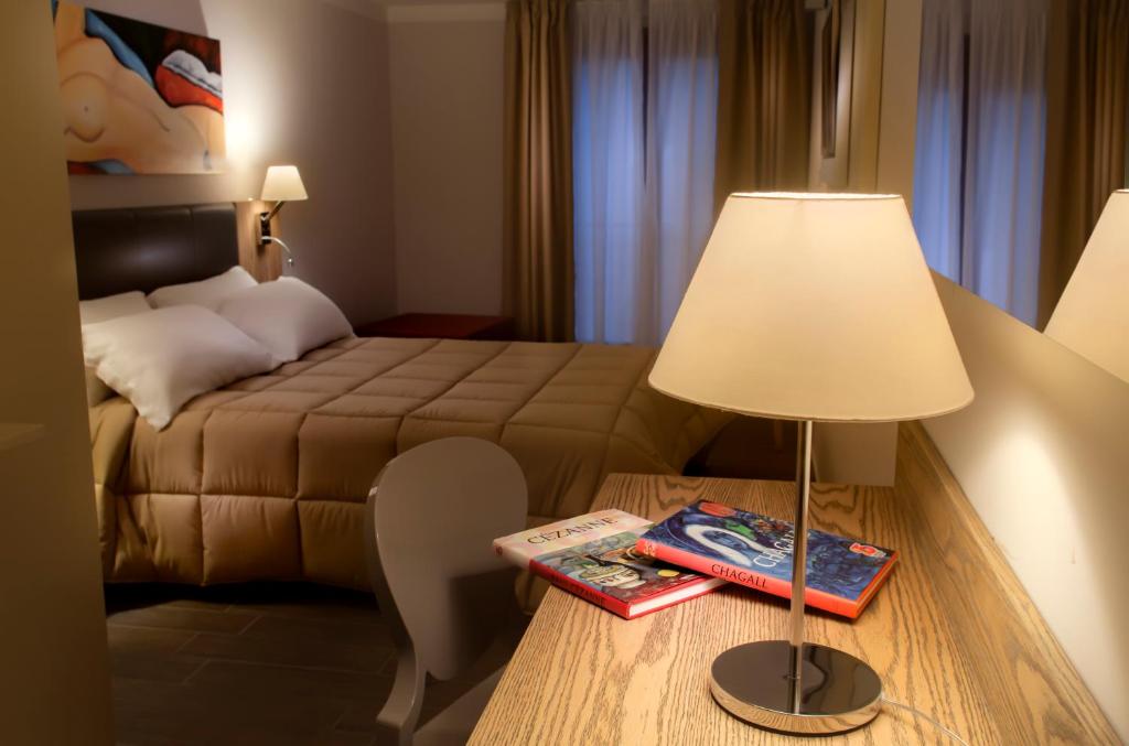 Cama ou camas em um quarto em La Maison D'Art