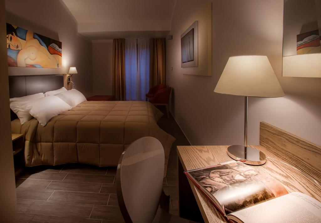 Cama ou camas em um quarto em La Maison D'Art