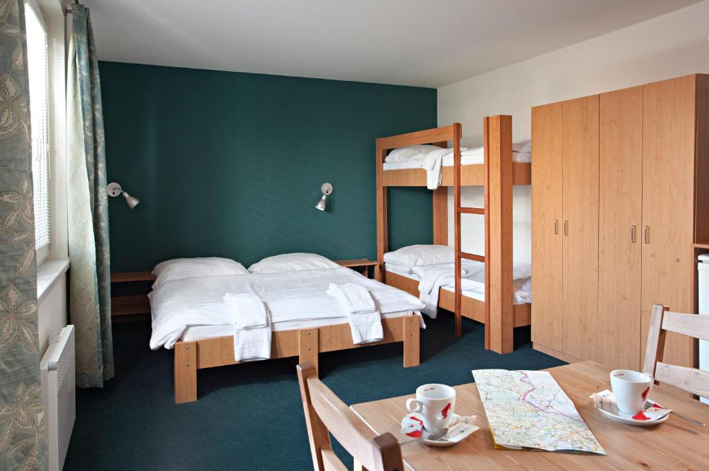 Postel nebo postele na pokoji v ubytování Hotel Termal Mušov