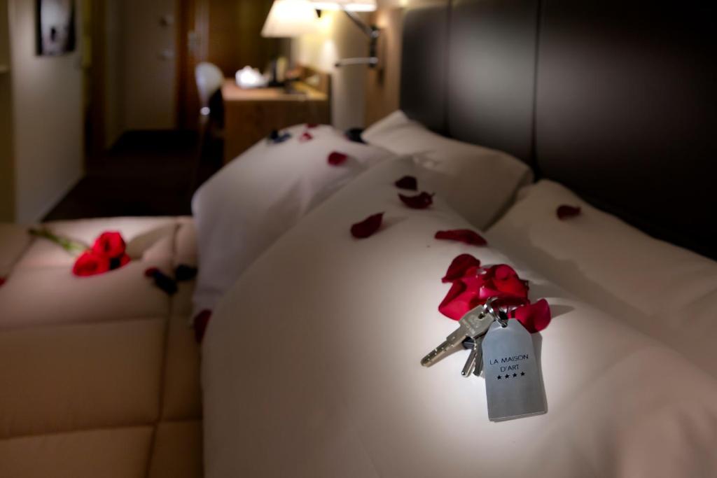 Cama ou camas em um quarto em La Maison D'Art