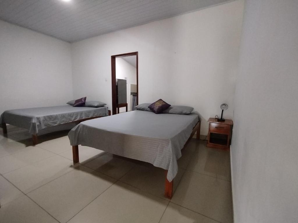 Postel nebo postele na pokoji v ubytování Kanaq Hotel Tours