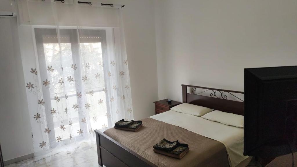 Postel nebo postele na pokoji v ubytování Reggio'S House