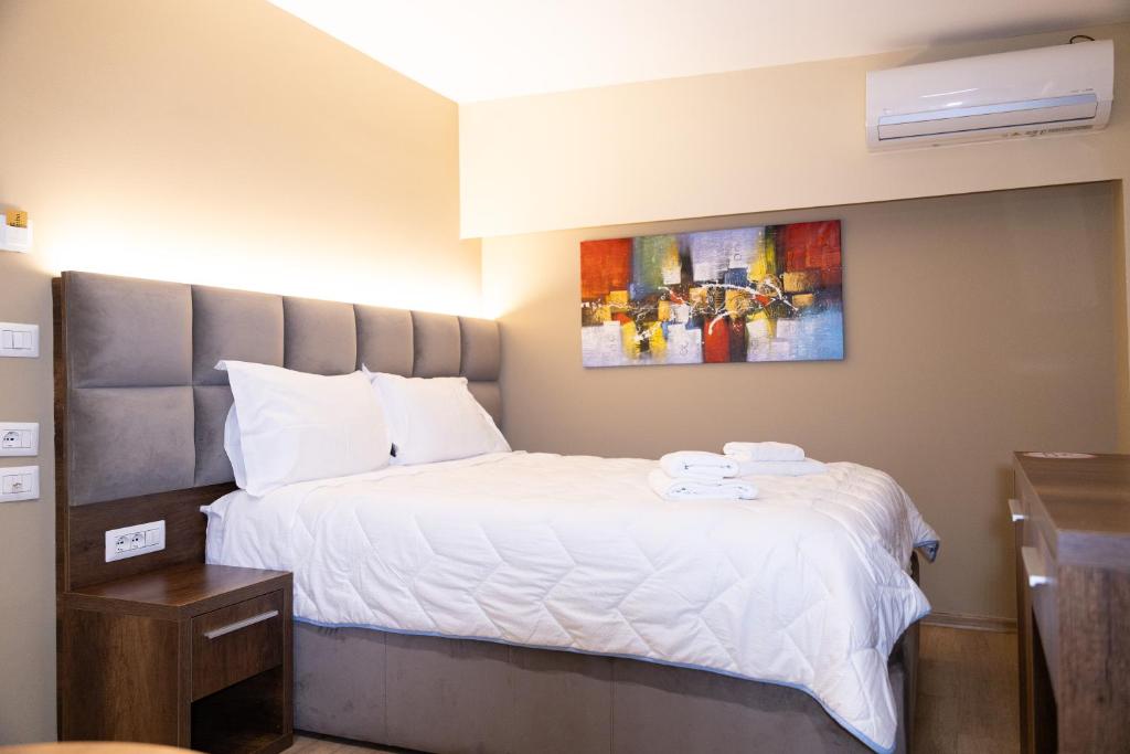 Postel nebo postele na pokoji v ubytování 4R Colombo Hotel