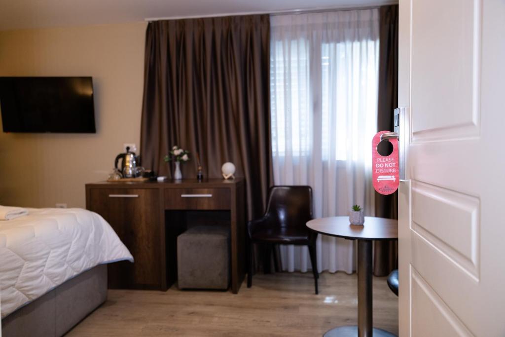 Postel nebo postele na pokoji v ubytování 4R Colombo Hotel