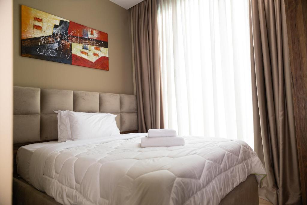 Postel nebo postele na pokoji v ubytování 4R Colombo Hotel